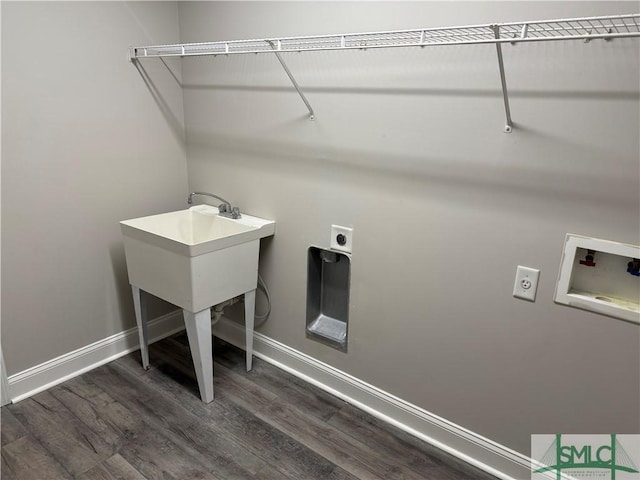 clothes washing area with washer hookup, dark wood-type flooring, and hookup for an electric dryer