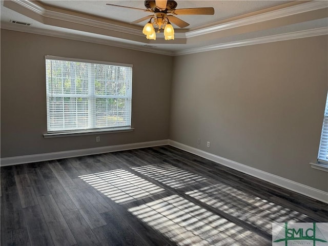 unfurnished room with crown molding, dark wood-type flooring, a raised ceiling, and ceiling fan