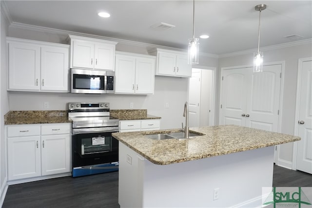 kitchen featuring appliances with stainless steel finishes, sink, pendant lighting, a center island with sink, and white cabinetry