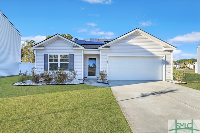 single story home with a front yard, solar panels, and a garage