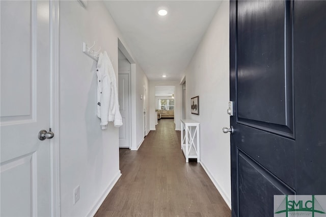 hall with dark hardwood / wood-style floors