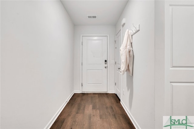 doorway with dark hardwood / wood-style flooring