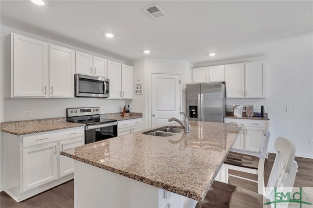 kitchen featuring sink, a center island with sink, and appliances with stainless steel finishes