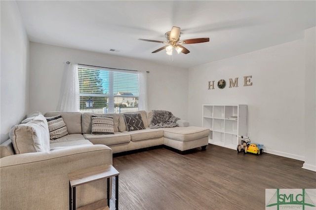 living room featuring dark hardwood / wood-style floors and ceiling fan