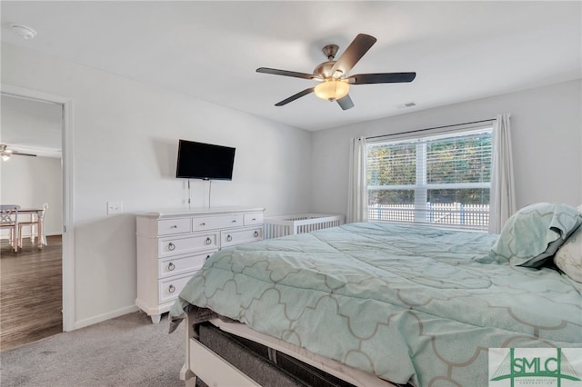 bedroom featuring ceiling fan and light hardwood / wood-style flooring