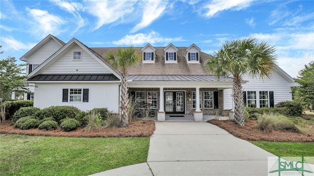 view of front of property with a porch and a front yard