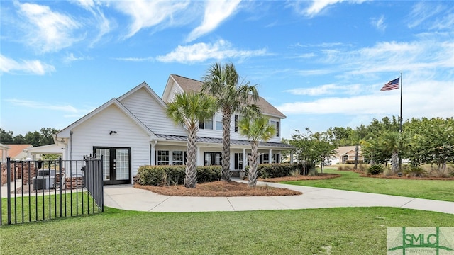 view of front of property with french doors and a front yard