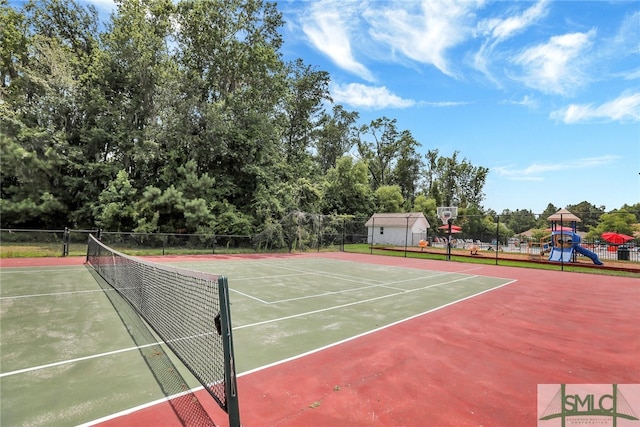 view of sport court with a playground