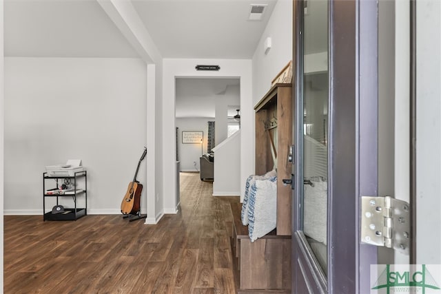 corridor with dark hardwood / wood-style floors