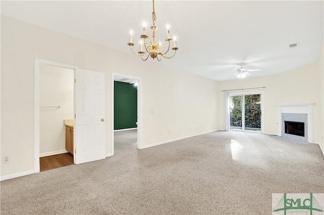 2 Putters Pl, Savannah, GA 31419 - unfurnished living room featuring a chandelier, a ceiling fan, baseboards, and a fireplace with flush hearth