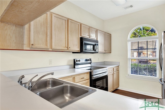 kitchen featuring dark hardwood / wood-style flooring, sink, light brown cabinetry, and electric range oven