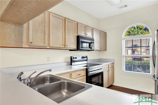 2 Putters Pl, Savannah, GA 31419 - kitchen featuring black microwave, electric range, light brown cabinets, a sink, and light countertops