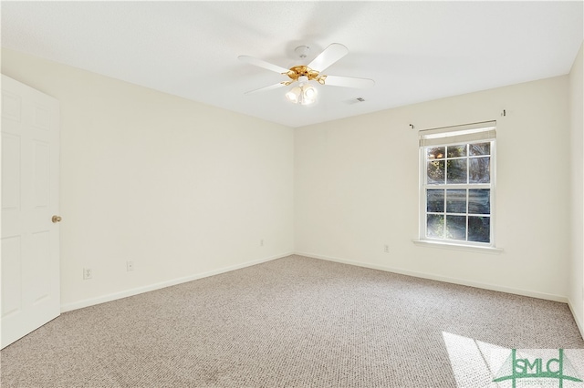 spare room with ceiling fan and carpet floors