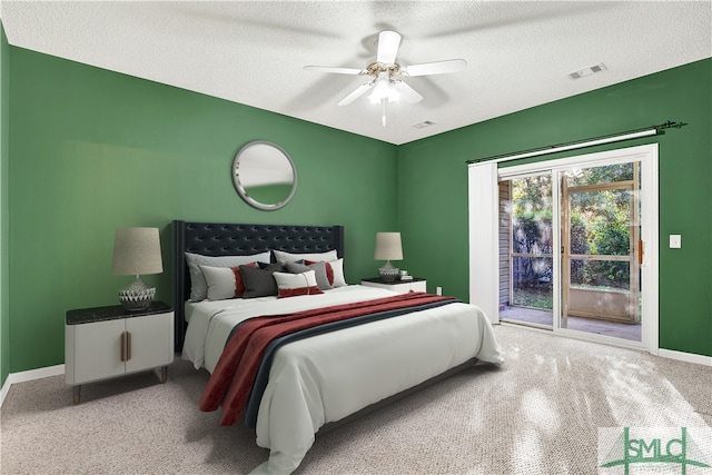 carpeted bedroom featuring ceiling fan, a textured ceiling, and access to outside