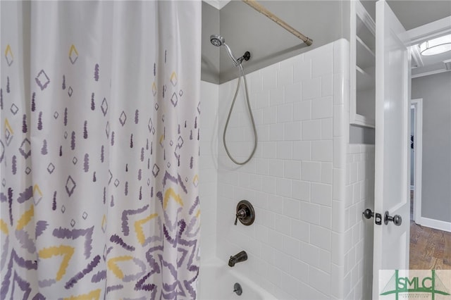 bathroom featuring hardwood / wood-style floors and shower / bath combo