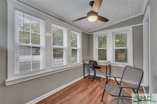 sunroom with ceiling fan and lofted ceiling