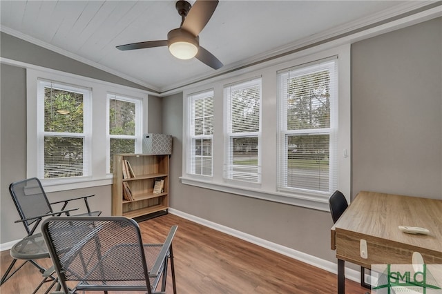 sunroom / solarium featuring ceiling fan and vaulted ceiling