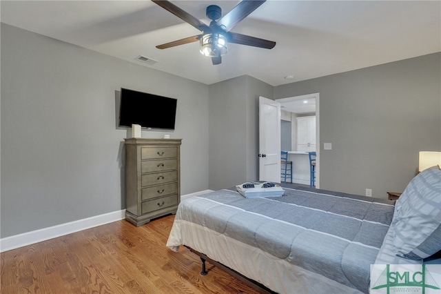 bedroom featuring light hardwood / wood-style floors and ceiling fan