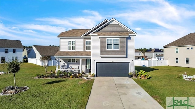 view of front of property featuring a garage and a front yard