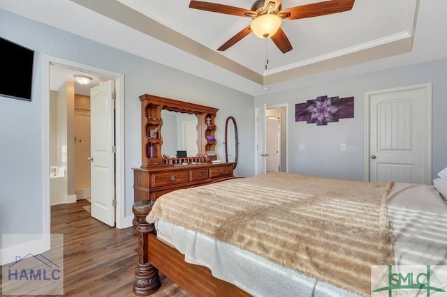 126 Thornbush Ct NE, Ludowici, GA 31316 - bedroom with ceiling fan, hardwood / wood-style flooring, a tray ceiling, and ornamental molding
