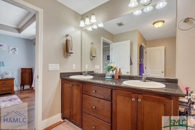 126 Thornbush Ct NE, Ludowici, GA 31316 - bathroom with wood-type flooring and vanity