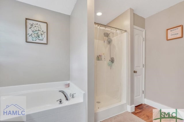 126 Thornbush Ct NE, Ludowici, GA 31316 - bathroom featuring hardwood / wood-style flooring and independent shower and bath