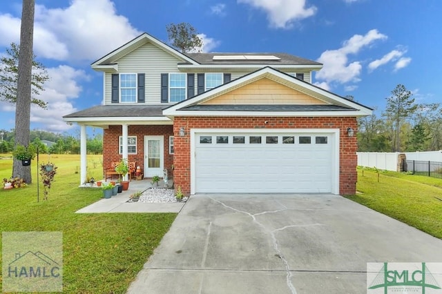 view of front of property featuring a front yard and a garage