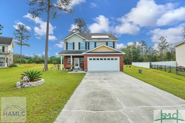 view of front of property featuring a garage, solar panels, and a front yard