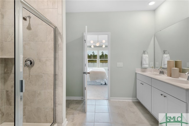 full bathroom featuring ensuite bathroom, a sink, and a shower stall