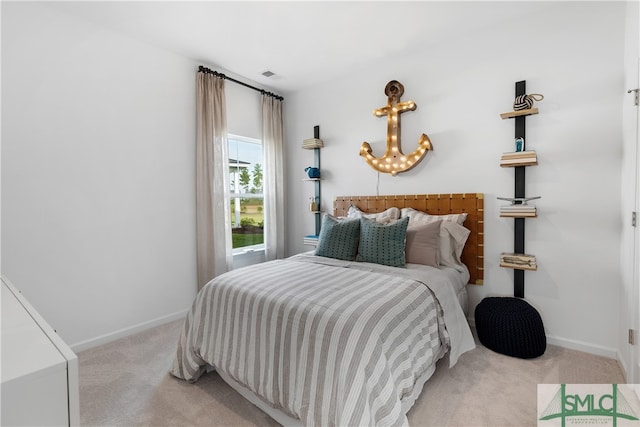 bedroom featuring light carpet, visible vents, and baseboards