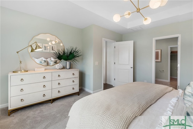 bedroom featuring a chandelier, carpet flooring, visible vents, and baseboards