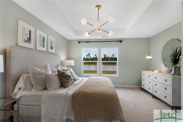 bedroom featuring baseboards, a chandelier, a raised ceiling, and light colored carpet