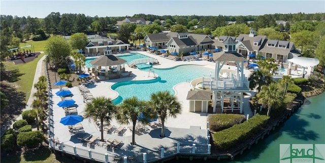 birds eye view of property featuring a water view and a residential view