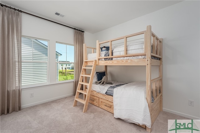 bedroom featuring carpet, visible vents, and baseboards