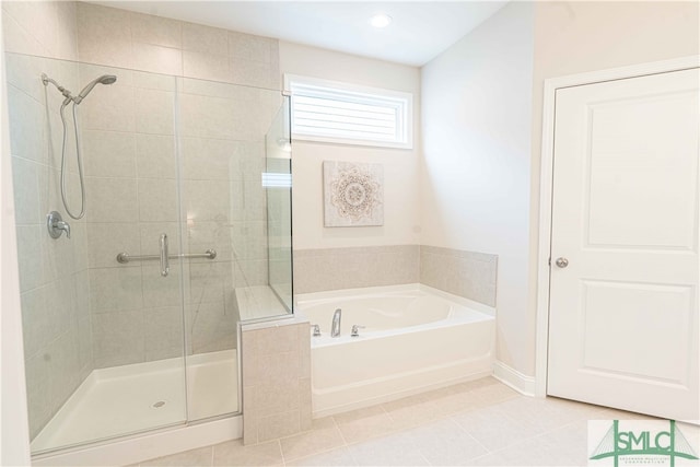 bathroom featuring tile patterned floors and plus walk in shower