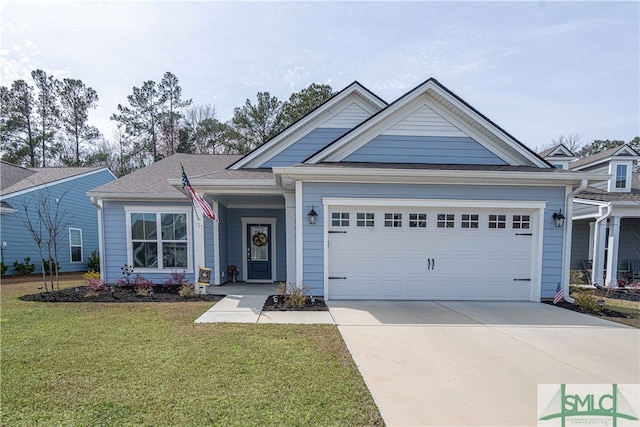 view of front facade featuring a garage and a front lawn