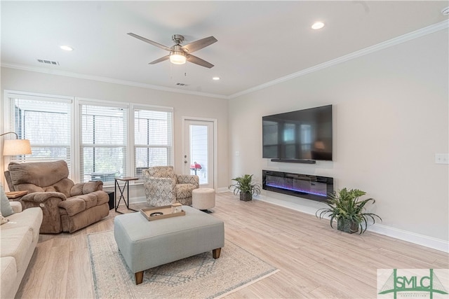 living room with crown molding, ceiling fan, and light hardwood / wood-style floors