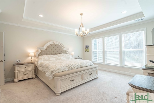 carpeted bedroom featuring multiple windows, a raised ceiling, and an inviting chandelier