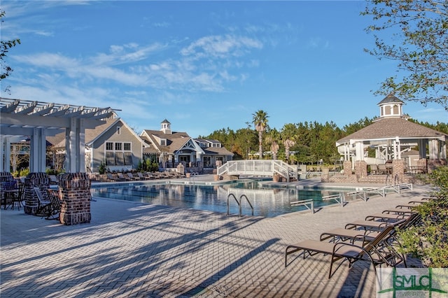 view of pool featuring a gazebo and a pergola