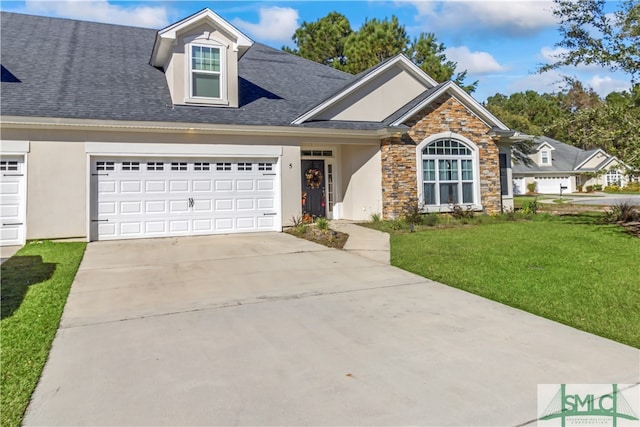 view of front facade featuring a garage and a front yard