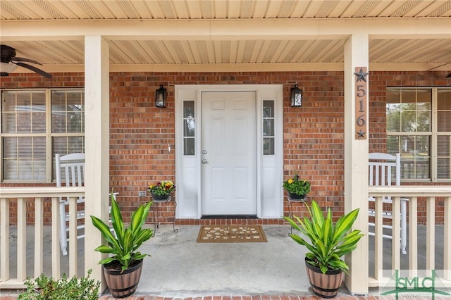 view of exterior entry with ceiling fan