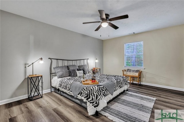 bedroom featuring ceiling fan and wood-type flooring