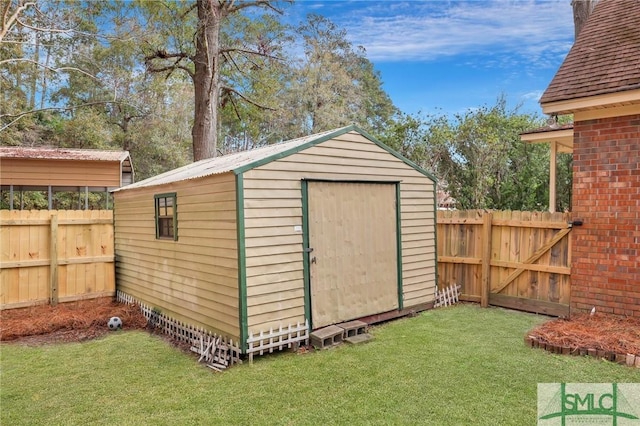 view of outbuilding with a lawn