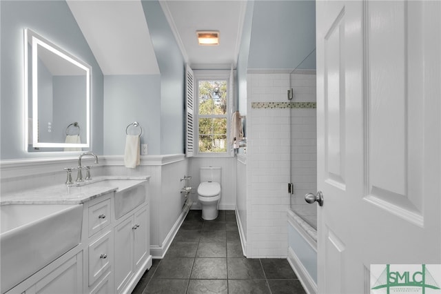 bathroom featuring crown molding, vanity, vaulted ceiling, and toilet