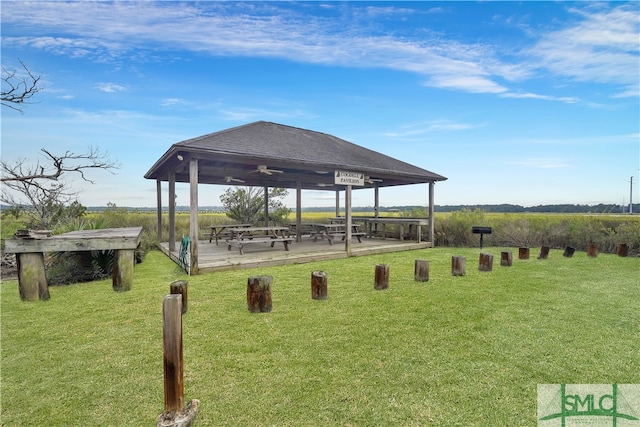 surrounding community featuring a gazebo, a rural view, and a lawn