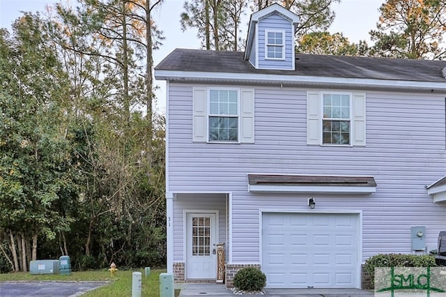 view of front of property with a garage