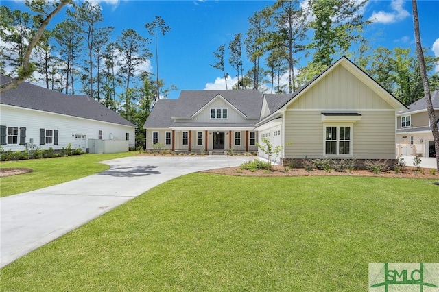 rear view of property featuring a lawn