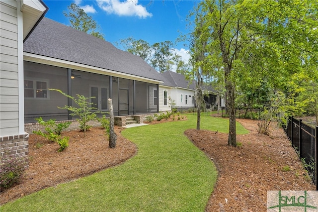 view of yard with a sunroom