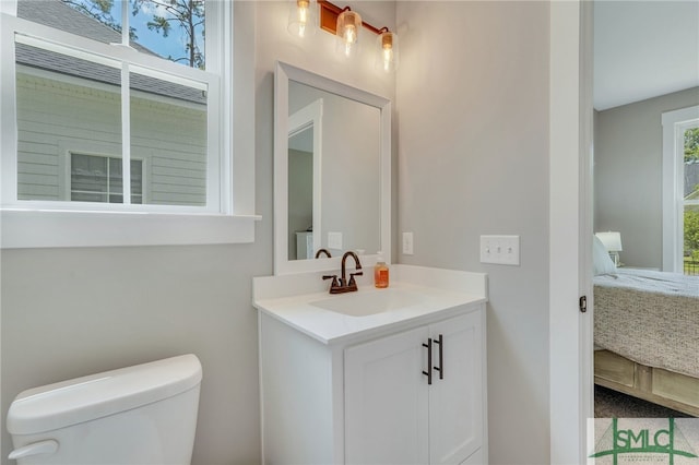 bathroom featuring vanity and toilet