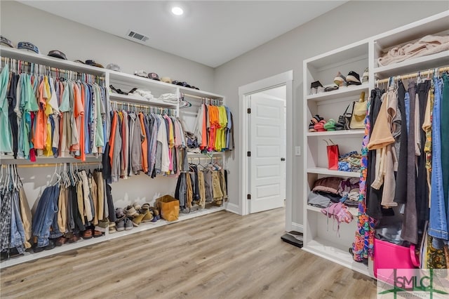 walk in closet featuring light hardwood / wood-style floors